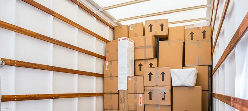 inside-van-with-boxes-579404929